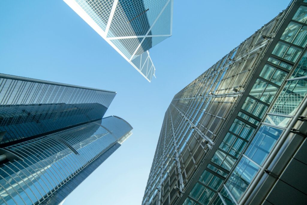 Low Angle Photography of Buildings Under Blue and White Sky